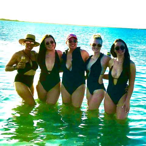 a group of people swimming in a body of water