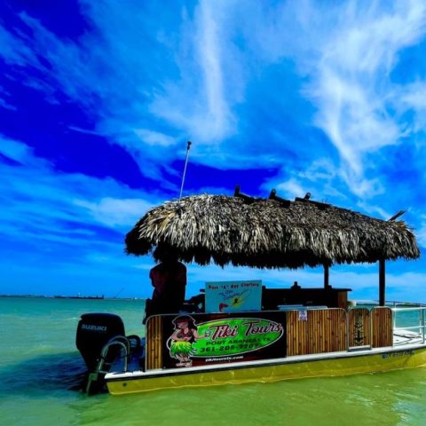 an umbrella sitting on top of a body of water