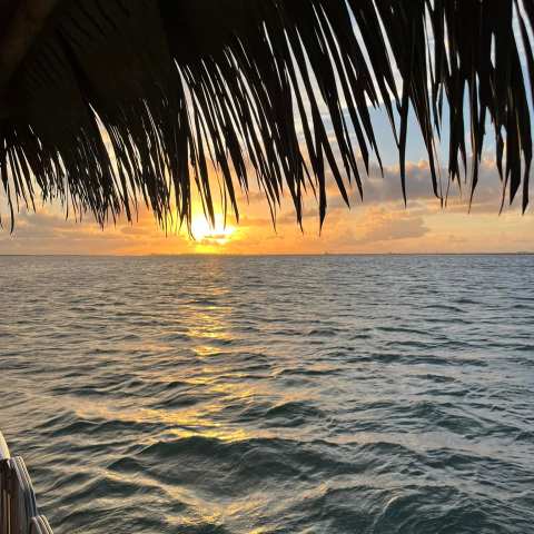 a sunset over a body of water